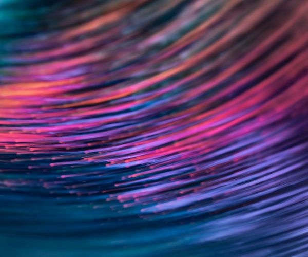 Abstract image representing flow with intertwined lines of light.